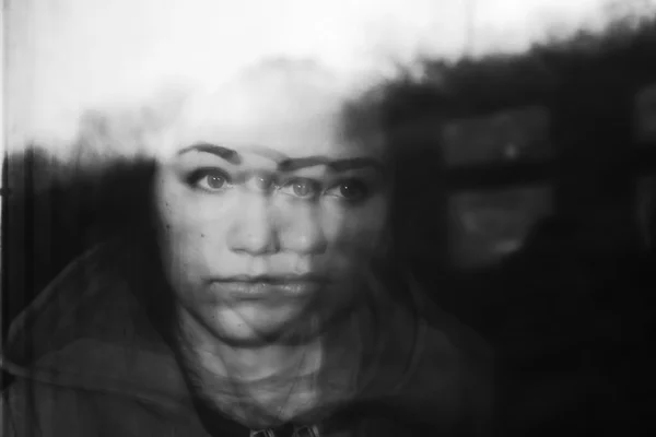 Portrait of girl, reflected in window of train — Stock Photo, Image