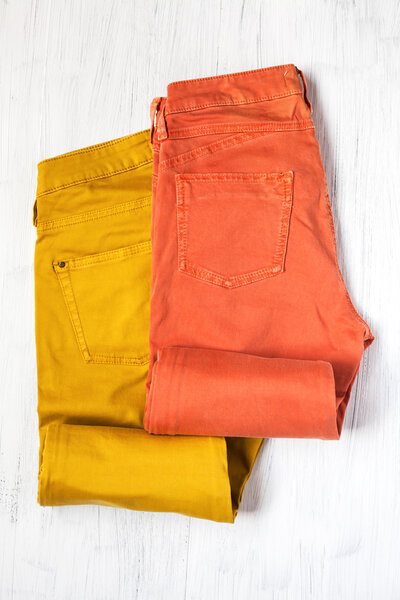 Clothing and fashion accessories on wooden table