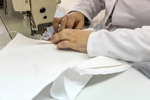 Industrial sewing machines with sewing machine operator — Stock Photo, Image