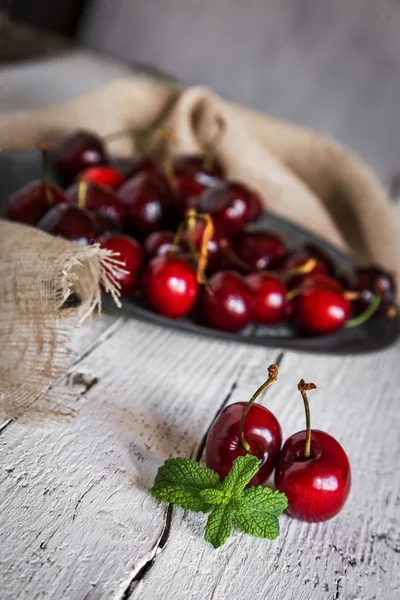 Fresh cherries on wooden table — Stock Photo, Image