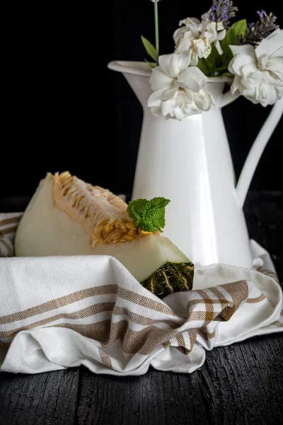 Fresh melon on the wooden table, selective focus — Stock Photo, Image