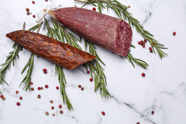 Assortment of typical Spanish homemade sausages with a colorful background. Iberian Chorizo and Salchichon