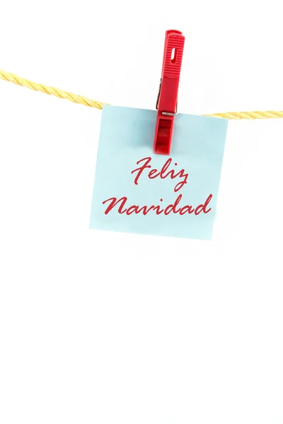 Uwaga, kolorowy papier z słowo feliz navidad — Zdjęcie stockowe