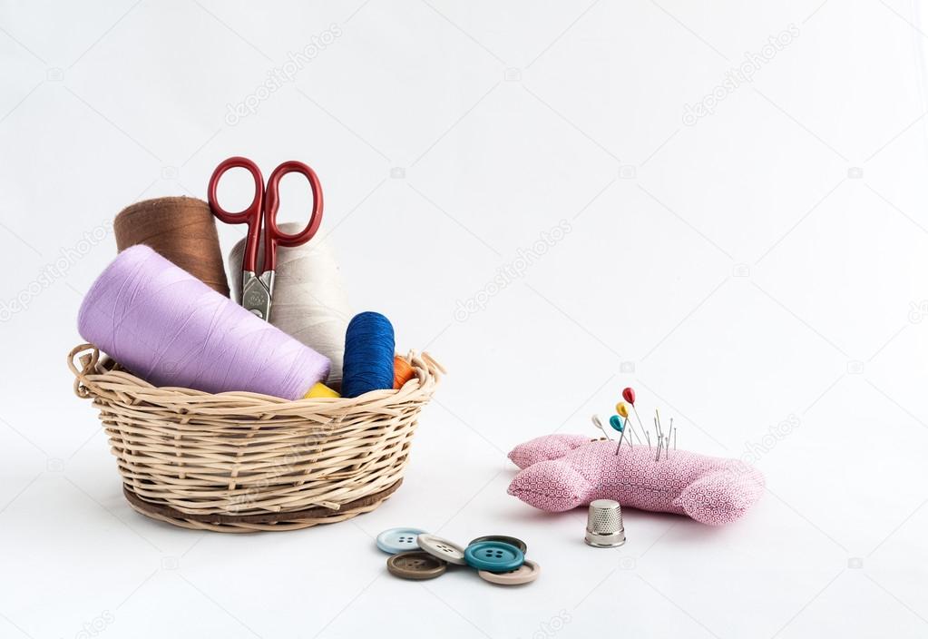 Sewing utensils, scissors, thread, buttons isolated on white bac
