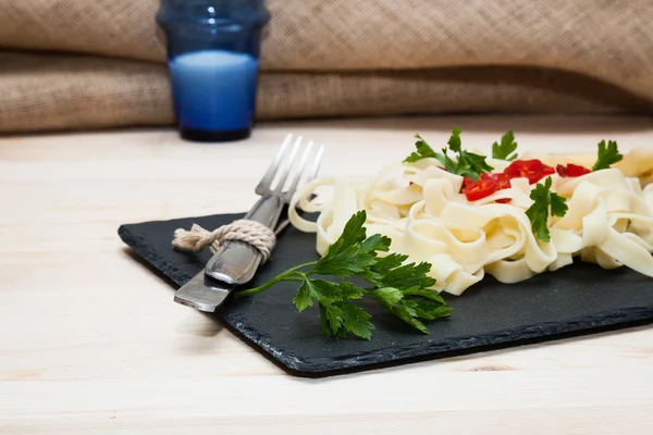 Fettuccini  Italian pasta with parsley and hot peppers — Stock Photo, Image