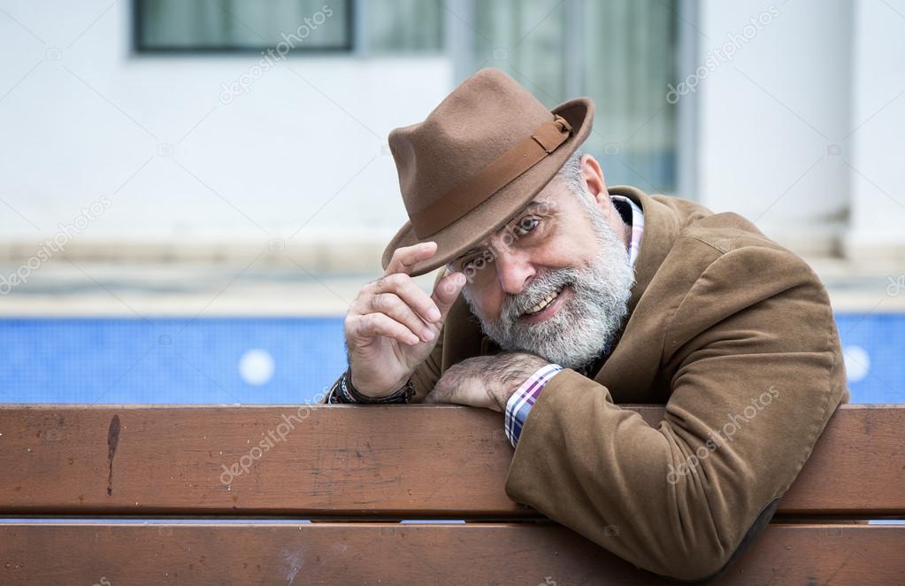 Attractive old man with beard and hat