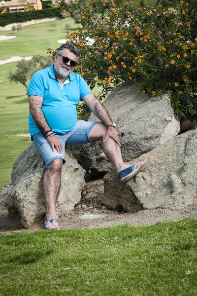 Attractive bearded man on a golf course