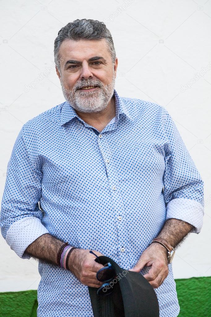 Attractive old man with beard and hat