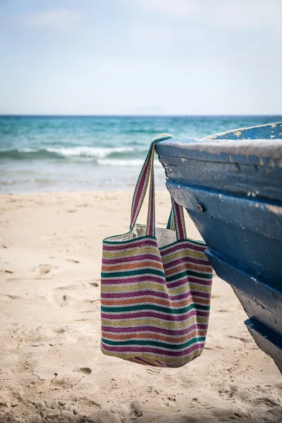 Set of various clothes and accessories for women on the beach — Stock Photo, Image