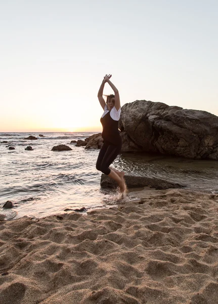 Attractive woman playing on the beach — Stock Photo, Image