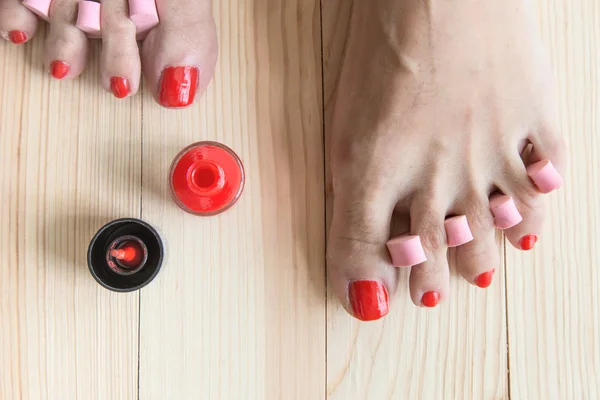 Woman painting toe nails — Stock Photo, Image