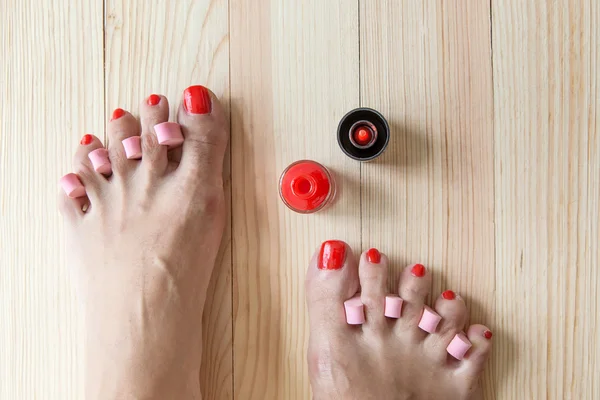 Woman painting toe nails