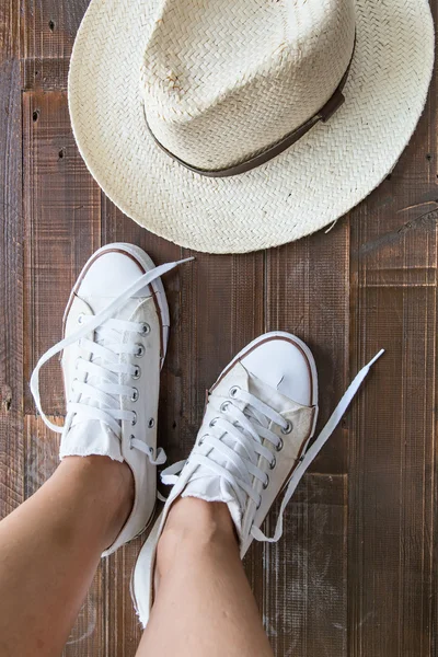 Retro sneakers left on wooden floor — Stock Photo, Image