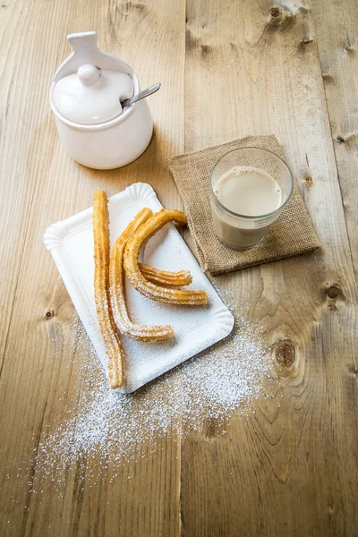 Churros con café con leche y azúcar — Foto de Stock