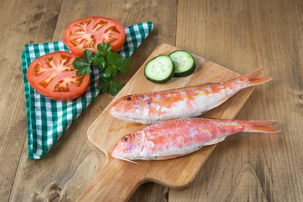 Fresh red mullet with tomatoes and parsley — Stock Image Fresh red mullet with tomatoes and parsley Royalty Free Stock Photos