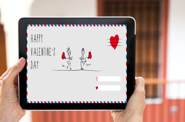 Hände halten Tablette mit Schild Valentinstag — Stockfoto