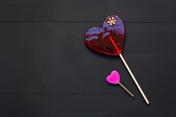 Still life of candy lollipop and handmade heart — Stock Photo, Image