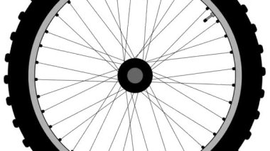 Dönen eski moda bir bisiklet tekerleği beyaz bir arka plan üzerinde
