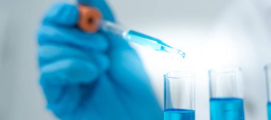 Scientist analyze biochemical samples in advanced scientific laboratory. Medical professional use dropper mix microbiological developmental of viral. Biotechnology research in  science lab. cosmetic