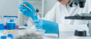 Scientist analyze biochemical samples in advanced scientific laboratory. Medical professional use dropper mix microbiological developmental of viral. Biotechnology research in  science lab. cosmetic