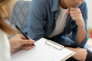 man with mental health problems is consulting. psychiatrist is recording the patient's condition for treatment. encouragement, love and family problem, bipolar , depression patient, protect suicide