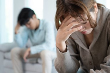 Divorce. Asian couples are desperate and disappointed after marriage. Husband and wife are sad, upset and frustrated after quarrels. distrust, love problems, betrayals. family problem, teenage lov