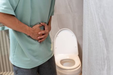 Constipation and diarrhea in bathroom. Hurt man touch belly  stomach ache painful. colon inflammation problem, toxic food, abdominal pain, abdomen, constipated in toilet, stomachache, Hygiene