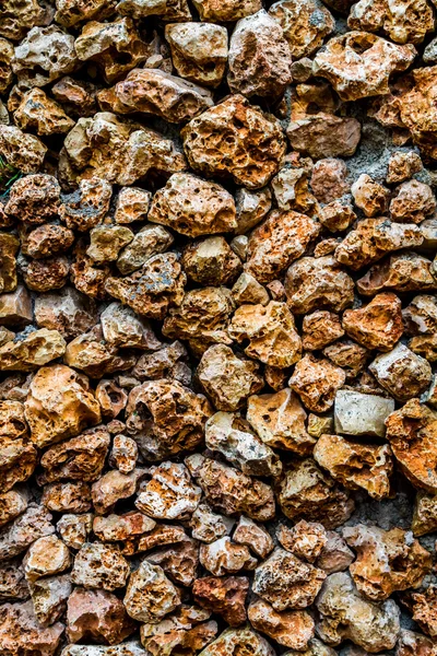 Parede de pedra com uma superfície porosa — Fotografia de Stock