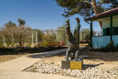 Sculpture of David Ben-Gurion standing on his head in kibbutz Sde Boker, Israel  clipart