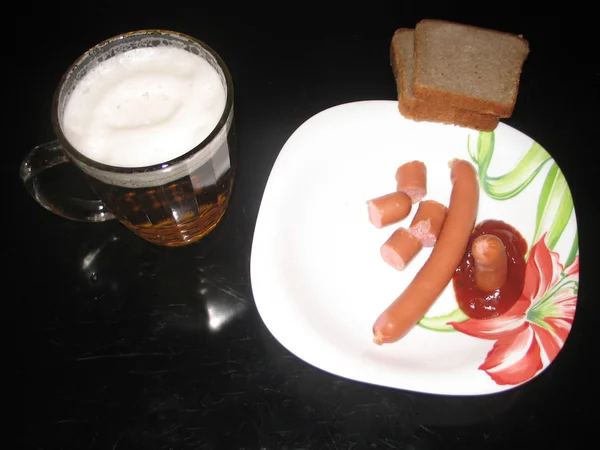 Beer and sausages. Tasty, high-calorie food and beverage