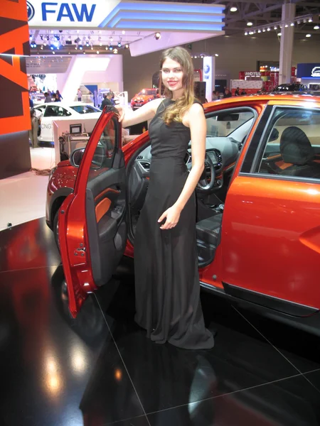 Girl model near to the machine. Moscow International Auto Show 2016. August 29th, 2016 — Stock Photo, Image