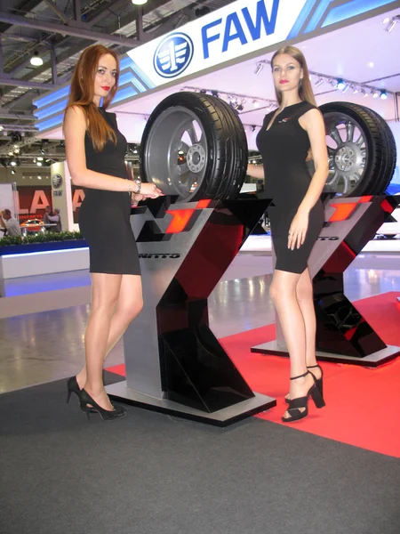 Female model working at an automobile exhibition. Moscow International Auto Show 2016 — Stock Image Female model working at an automobile exhibition. Moscow International Auto Show 2016 Stock Image