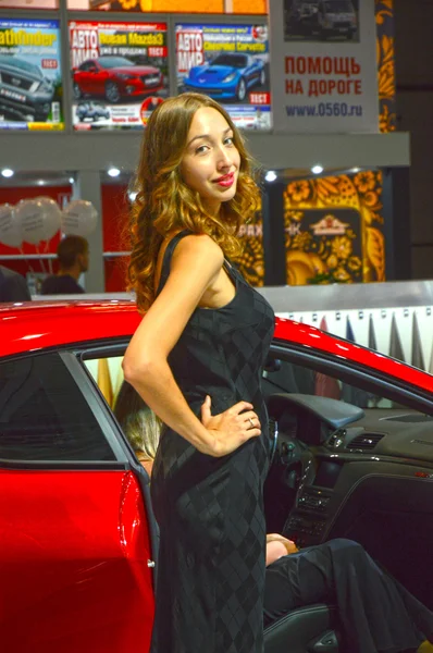 Moscow International Automobile Salon Women from Maserati team Red car — Stock Photo, Image