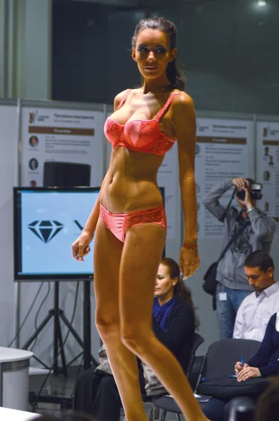 Intercharm XXI International Perfumery and Cosmetics Exhibition Lingrie Expo Traffic Young beautiful brunette in red lingerie Look Flash