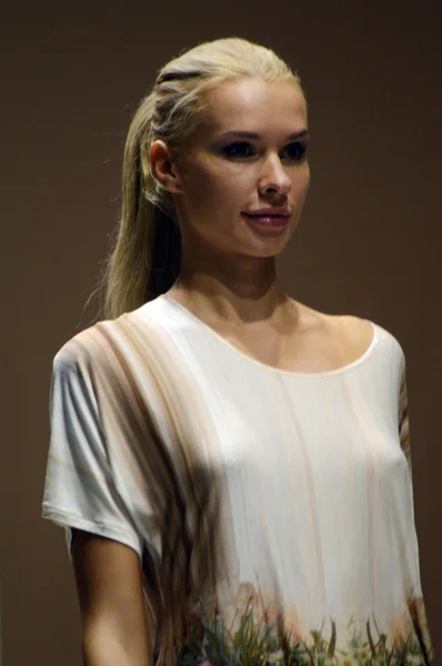 Young blond woman in a colorful nightgown, negligee Lingrie Expo Moscow — Stock Photo, Image