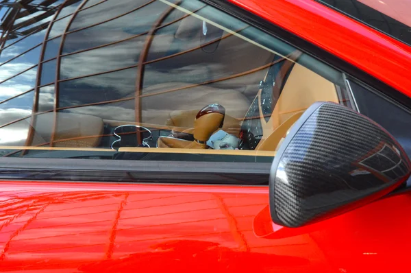 Red luxury sports car Rearview Mirror — Stock Photo, Image