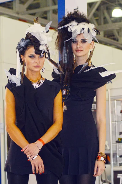 Intercharm XXI International Perfumery and Cosmetics Exhibition Two young beautiful womans in black dress — Stock Photo, Image