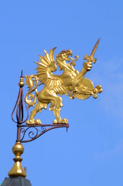 Coat of arms of the Romanov Boyars golden griffin with sword on the steeple  Heat — Stock Photo, Image