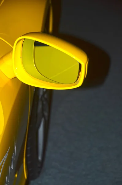 Rear view mirror Yellow sports car — Stock Photo, Image