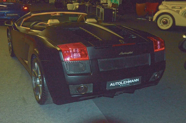 Lamborghini convertible color wet asphalt in the showroom — Stock Photo, Image