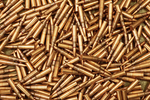 Background from military machine gun cartridges. Danger concept.