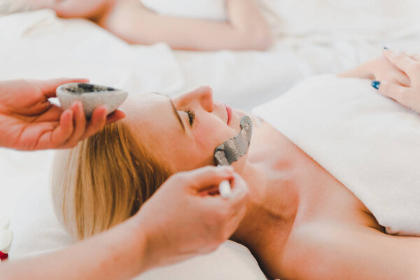 Young Woman Using Black Mud Mask Spa Facial Treatment Spa Royalty Free Stock Images