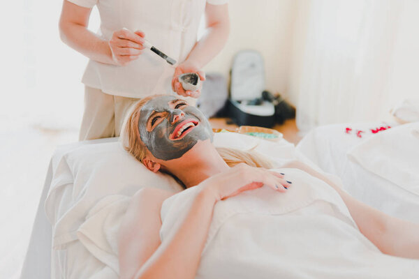 Young Woman Using Black Mud Mask Spa Facial Treatment Spa Stock Photo