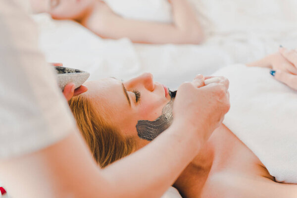 Young Woman Using Black Mud Mask Spa Facial Treatment Spa Royalty Free Stock Photos