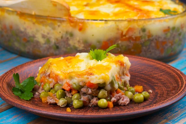 Potato, cheese, meat, carrot, onion and green peas casserole — Stock Photo, Image