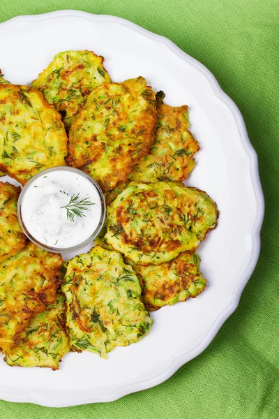 Zucchini Pancakes With  Sour Cream in White Plate — Stock Photo, Image