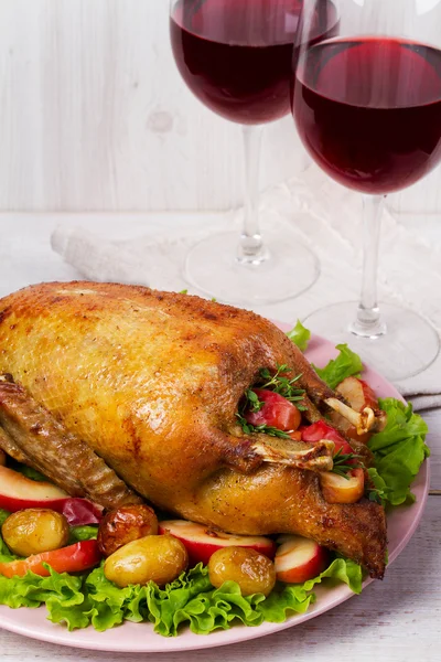 Roast duck with potato, apples, salad, thyme and rosemary — Stock Photo, Image
