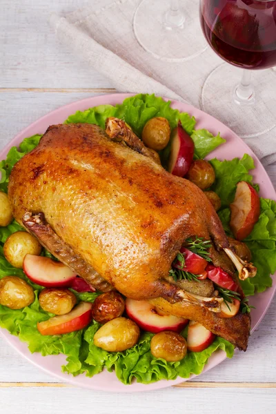 Roast duck with potato, apples, salad, thyme and rosemary — Stock Photo, Image