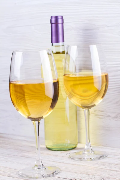 Glasses and bottle of white wine — Stock Photo, Image