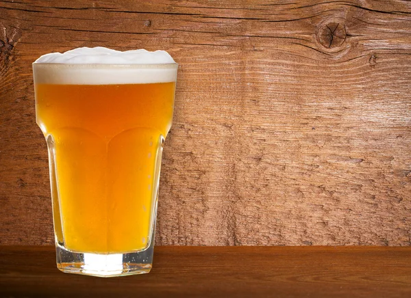 Beer on Old Wooden Shabby Background